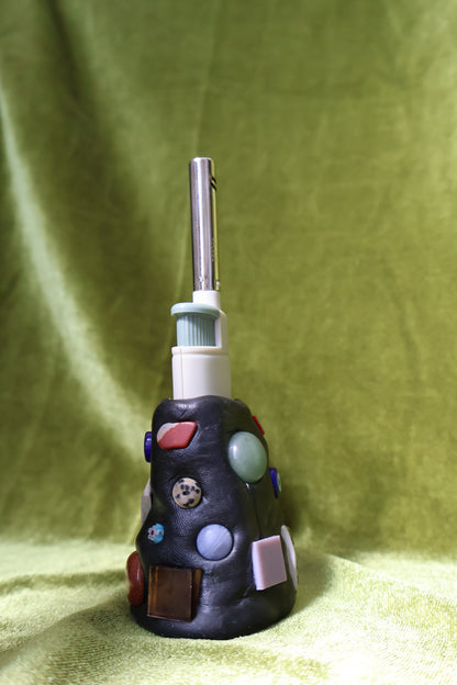 moss gem mosaic lighter holder on green velvet; lighter not included