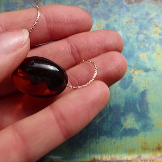 Cognac amber necklace, gold. Silent product video.